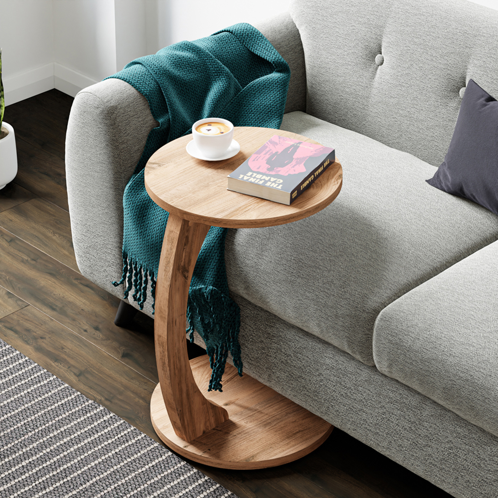 foto del prodotto  en.casa tavolino da divano holeby con rotelle e piano rotondo color legno