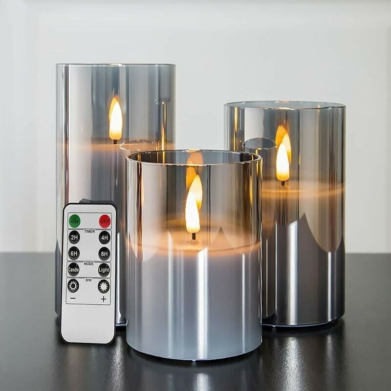 foto del prodotto candele tremolanti senza fiamma in vetro grigio argento con telecomando, confezione da 3 candele led finte realistiche 3 ore 4 5 6