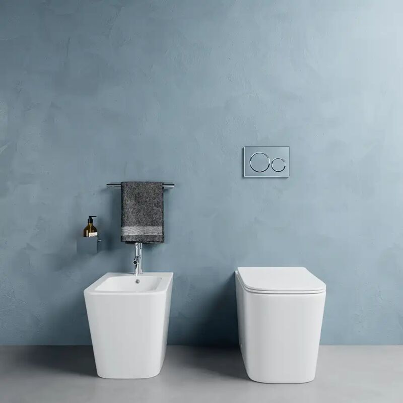 foto del prodotto coppia di sanitari filomuro in ceramica rimless bianco lucido vaso bidet e copriwc soft close mod. londra