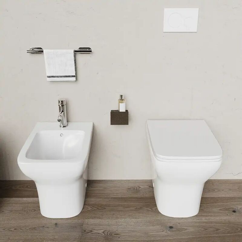foto del prodotto coppia di sanitari filomuro rimless in ceramica bianco lucido con vaso, bidet e copriwc soft close mod. havana