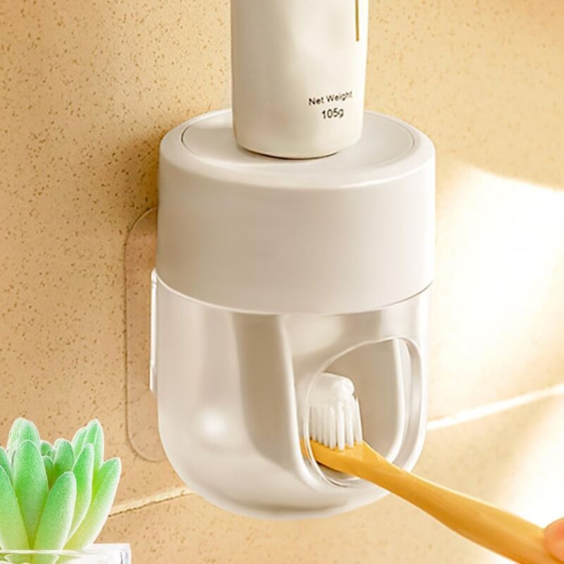foto del prodotto dispenser di dentifricio a parete per bagno, spremi dentifricio automatico, visualizzazione del flusso di dentifricio bianco e trasparente 