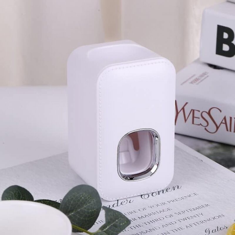 foto del prodotto distributore automatico di dentifricio bianco bebusingoto