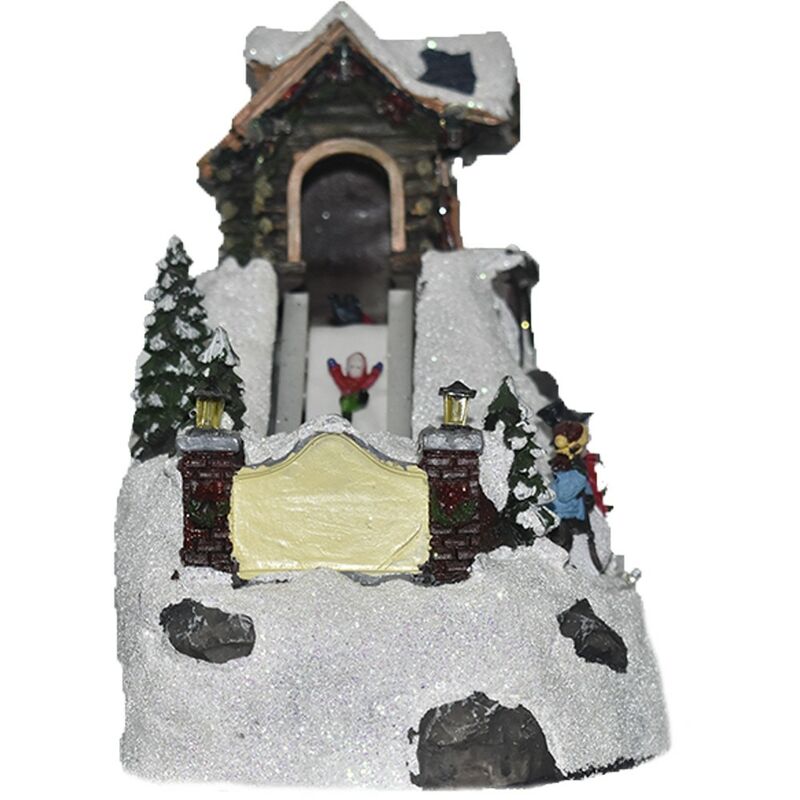 foto del prodotto giostra giostrina innevata villaggio babbo natale bambini sciatori decorazioni natalizi luci suoni movimento 19 cm