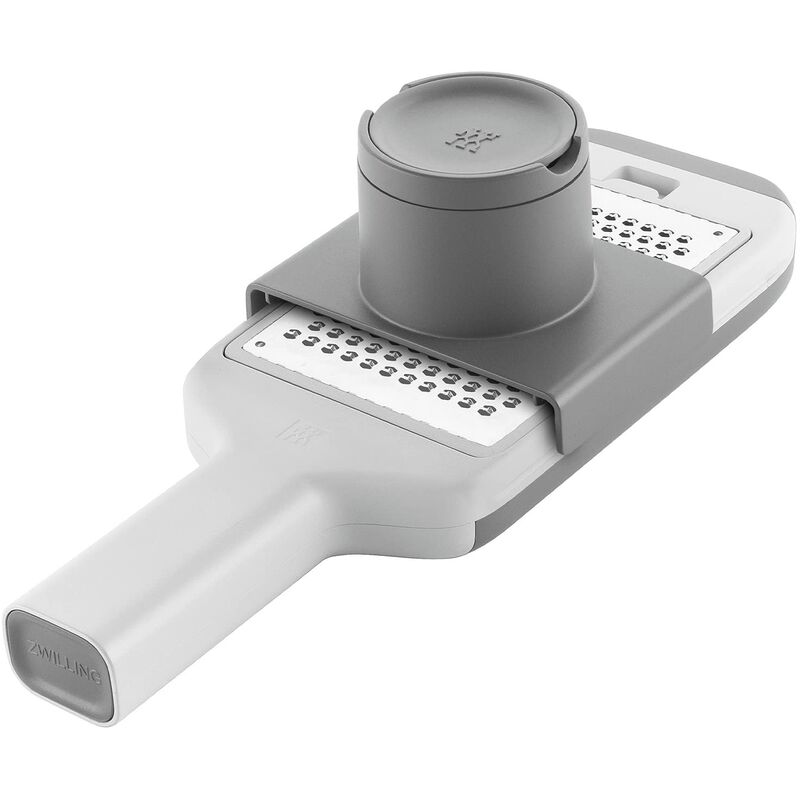 foto del prodotto grattugia multifunzione z cut, acciaio inox, 4 inserti intercambiabili con lame diverse, tecnologia a lame bidirezionali, vaschetta per raccogliere