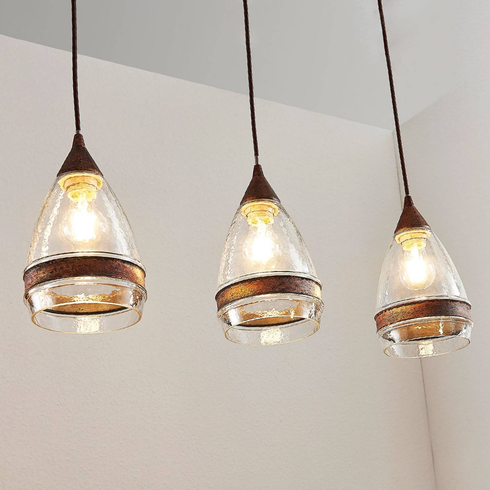 foto del prodotto lampada a sospensione in vetro lindby millina, 70 cm, marrone ruggine, a 3 luci.