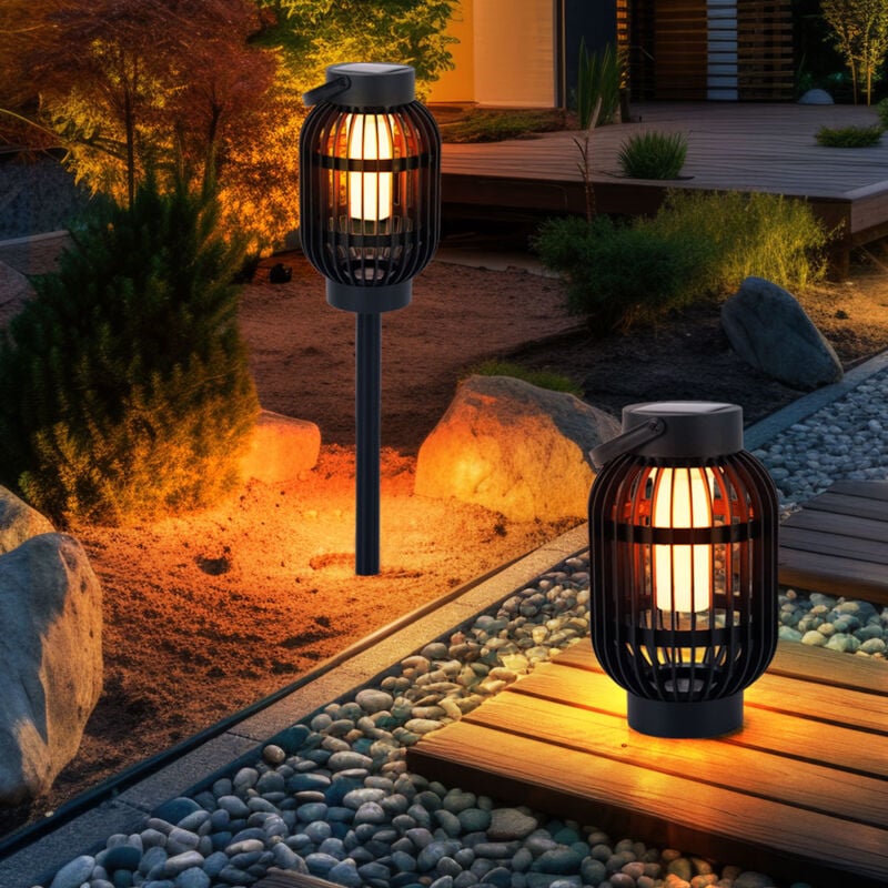 foto del prodotto lampada da tavolo a luce solare led effetto fiamma lampada da esterno 2 in 1 lampada da giardino con picchetto, plastica nera, con maniglia per il