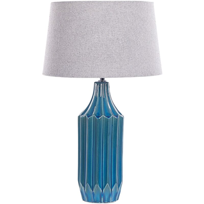 foto del prodotto lampada da tavolo in ceramica base a coste luce ambiente grigio e foglia di t abava