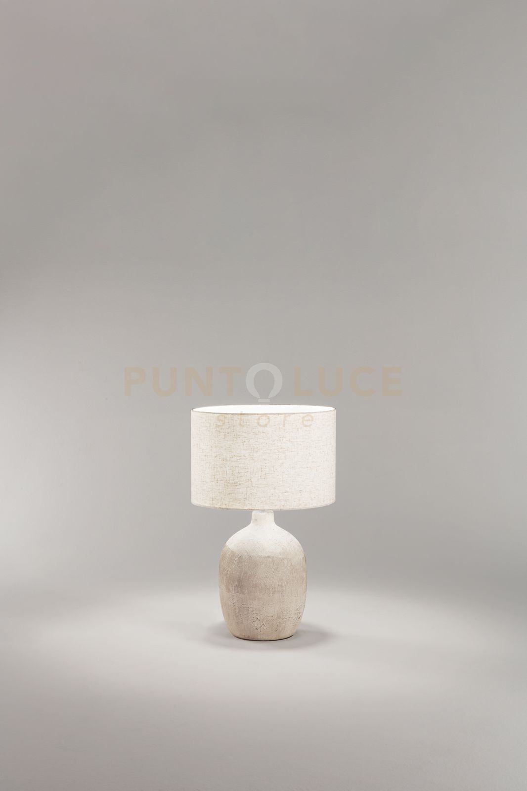 foto del prodotto lampada tribale da tavolo beige paralume in tessuto avana attacco e27 d.35cm
