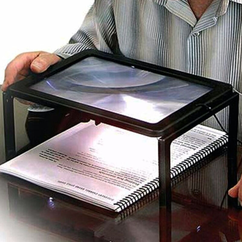 foto del prodotto lente ingrandimento da tavolo collo luce a led supporto lettura a pile trade shop traesio