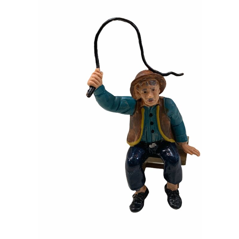 foto del prodotto magiedinatale statuetta per presepe natalizio uomo seduto con una frusta lucida h10 cm