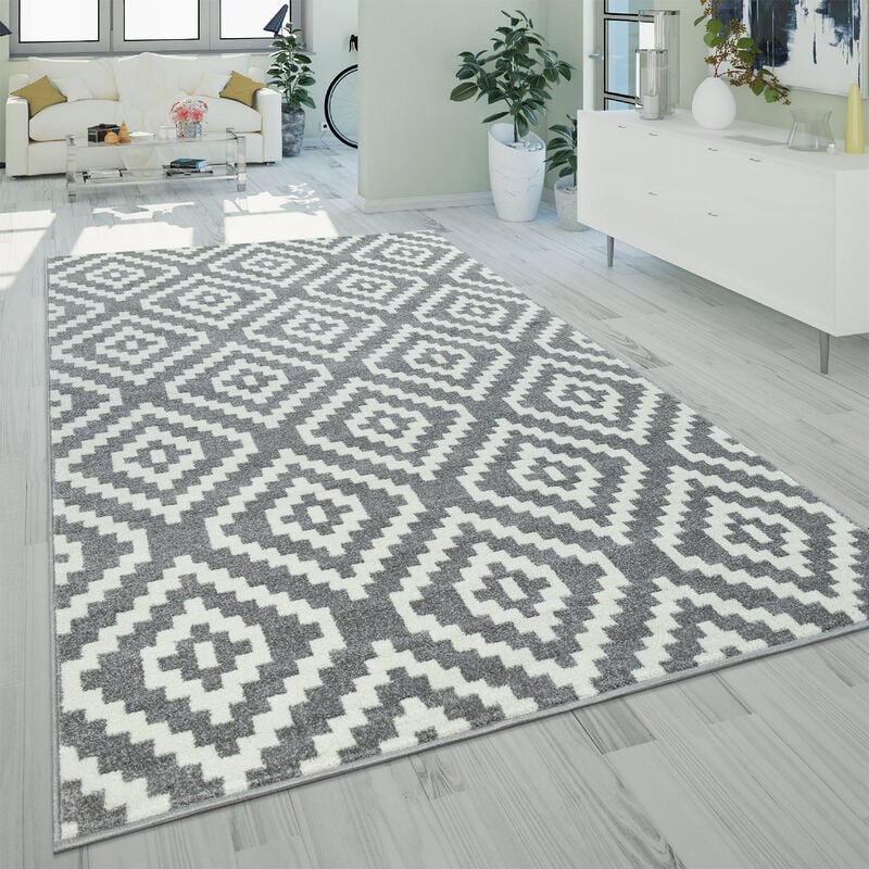 foto del prodotto moderno tappeto a pelo corto per il soggiorno con motivo di rombi geometrico in grigio e bianco 120x170 cm paco home
