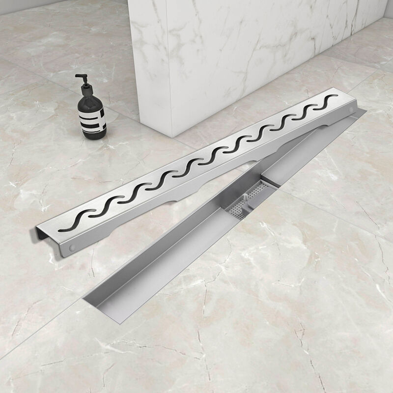 foto del prodotto ocean italy canalina di scarico doccia in acciaio inox con griglia a onde 70cm modello moderno canaletta doccia con sifone antiodore e