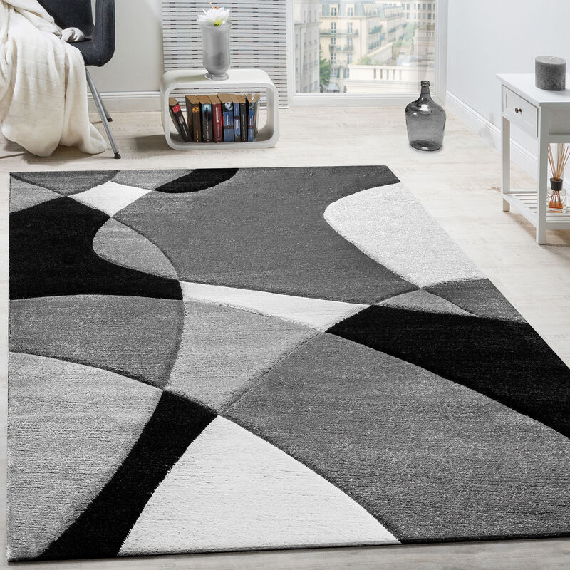 foto del prodotto paco home tappeto di design moderno motivo geometrico taglio sagomato in nero bianco 160x230 cm