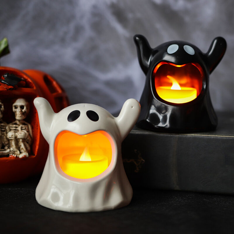 foto del prodotto portacandele nero da 8 cm, fantasma bianco di halloween, 2 candele a led, fiamma nera 1 pezzo nero, 1 pezzo bianco 