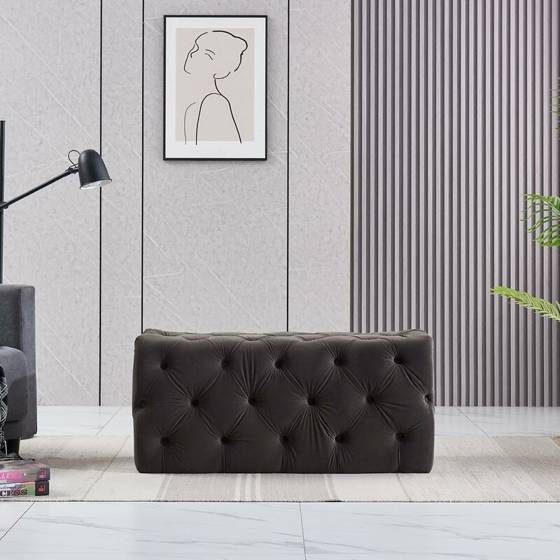 foto del prodotto pouf rettangolare piccolo in velluto melia, panca ottomana, poggiapiedi, design lux, dettagli con bottoni, antracite carbone