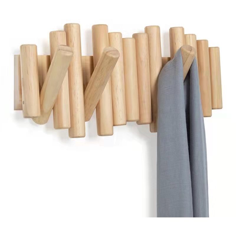 foto del prodotto rapanda appendiabiti da parete in legno massello fatto a mano con 5 ganci moderni e unici per cappotti, borse, cappelli, ombrelli