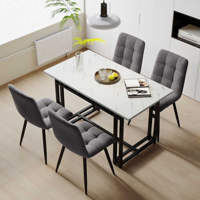 foto del prodotto set da pranzo bianco 120 x 70 cm con 4 sedie in velluto grigio. tavolo con gambe in ferro nero
