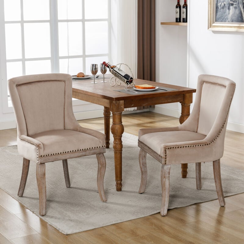 foto del prodotto set di 2 sedie da pranzo imbottite con finiture a borchie, gambe in legno massello, beige