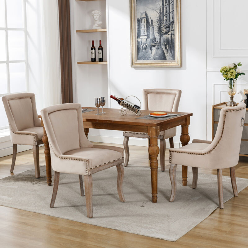 foto del prodotto set di 4 sedie da pranzo imbottite con finiture a borchie, gambe in legno massello, beige