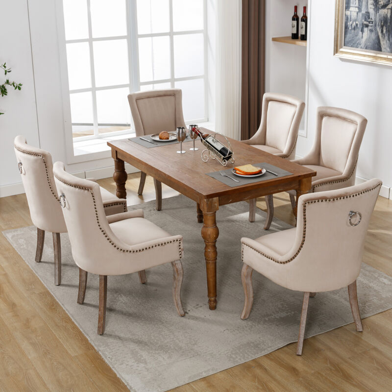 foto del prodotto set di 6 sedie da pranzo imbottite con finiture a borchie, gambe in legno massello, beige