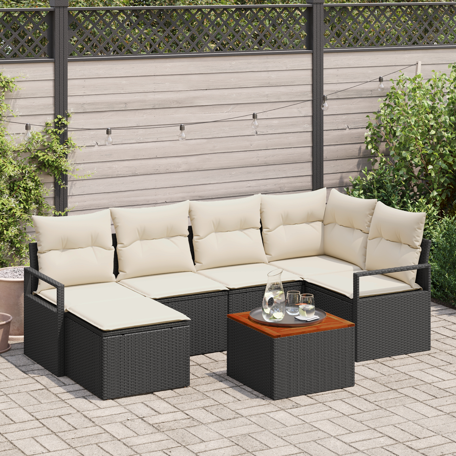 foto del prodotto set di divano da giardino 7 pezzi con cuscini in rattan polimerico nero e acacia