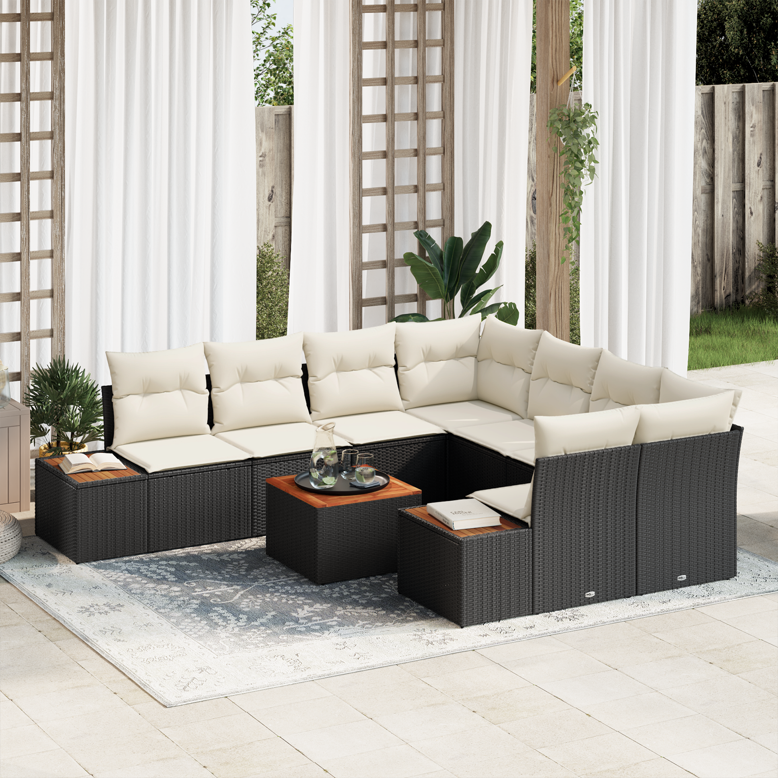 foto del prodotto set divano giardino 9 pezzi con cuscini nero in polyrattan e acacia