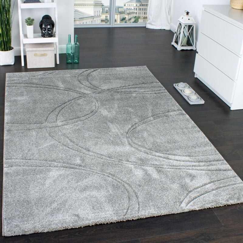 foto del prodotto tappeto monocromatico di design con bordi lavorati a mano color crema grigio 60x110 cm paco home