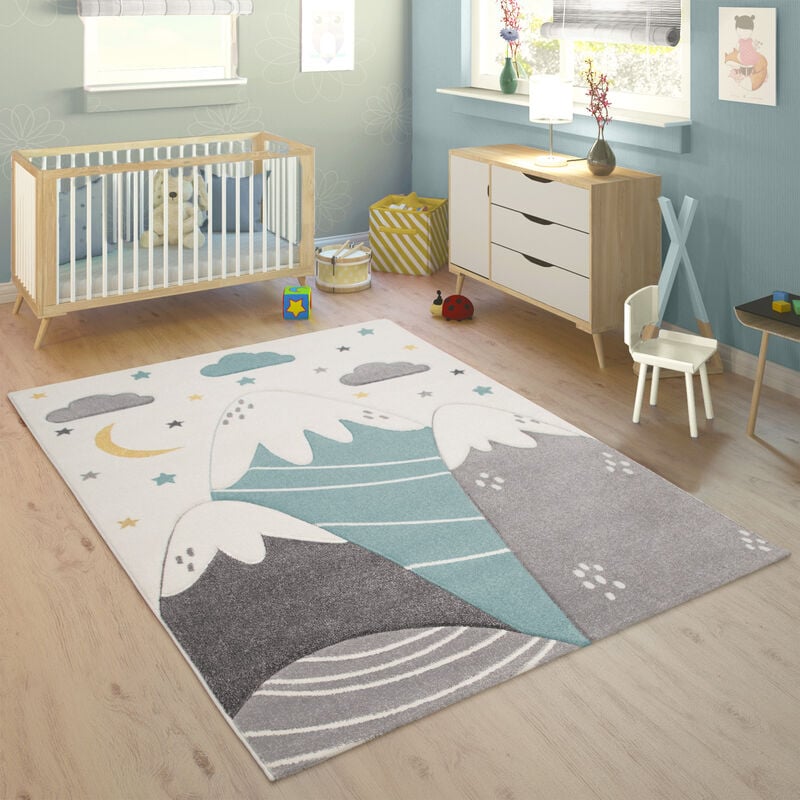 foto del prodotto tappeto per la cameretta dei bambini con motivo di montagna, luna e stelle nei colori pastello blu grigio 80x150 cm paco home