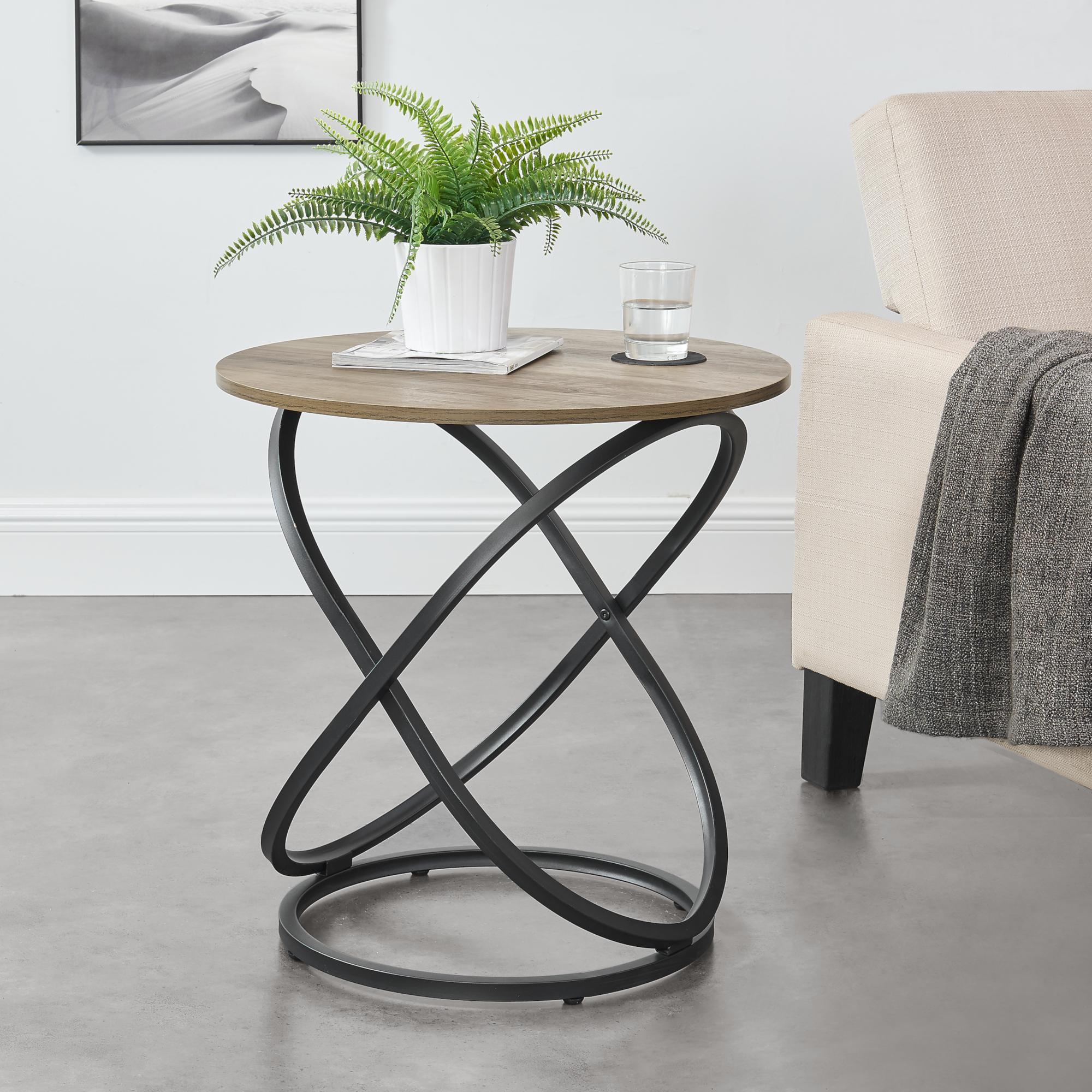 foto del prodotto tavolino da salotto lumsden con piano rotondo 59 cm e base spirale effetto legno nero en.casa 