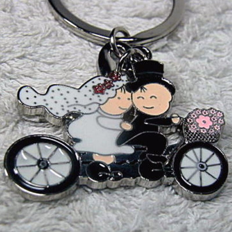 foto del prodotto trade shop traesio 12 portachiavi bomboniere confetti sposi in bici bicicletta matrimonio promessa 