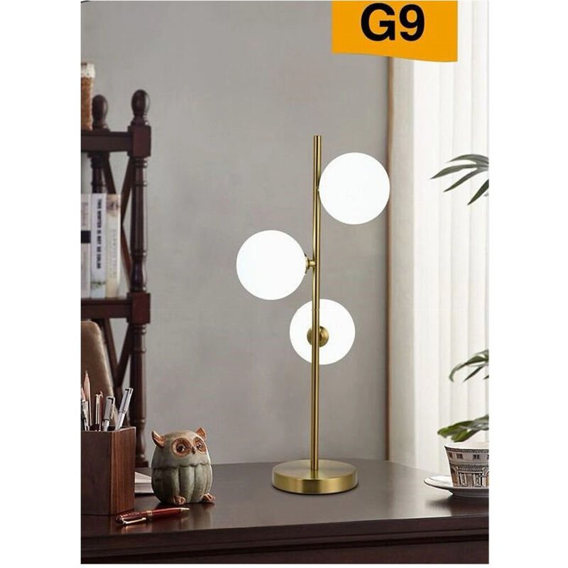 foto del prodotto trade shop traesio - lampada da tavolo g9 minimalista bronzo con 3 sfere piantana terra con stelo d33 -